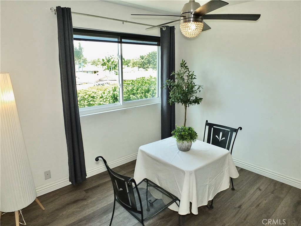 4591 Orange Avenue, Unit 306 Long Beach, CA 90807 - Photo 14 of 34 a white table sitting in a kitchen next to a window