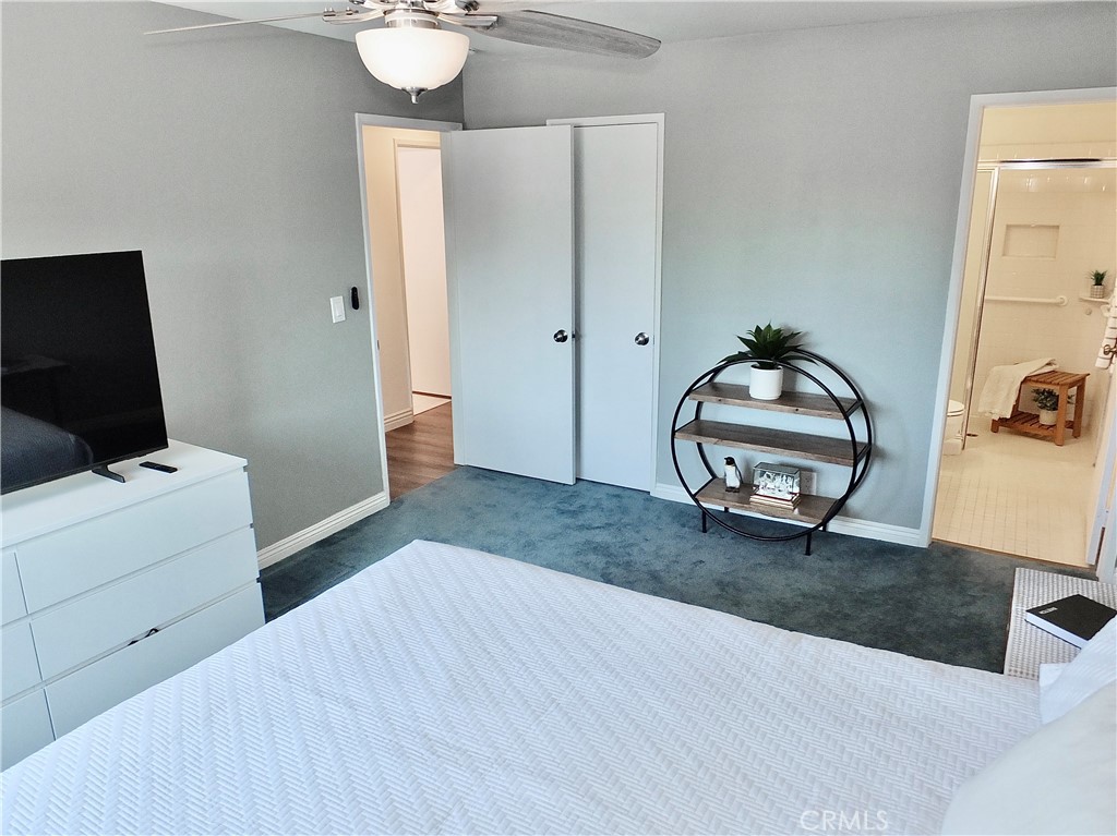 4591 Orange Avenue, Unit 306 Long Beach, CA 90807 - Photo 20 of 34 a living room with furniture and a flat screen tv