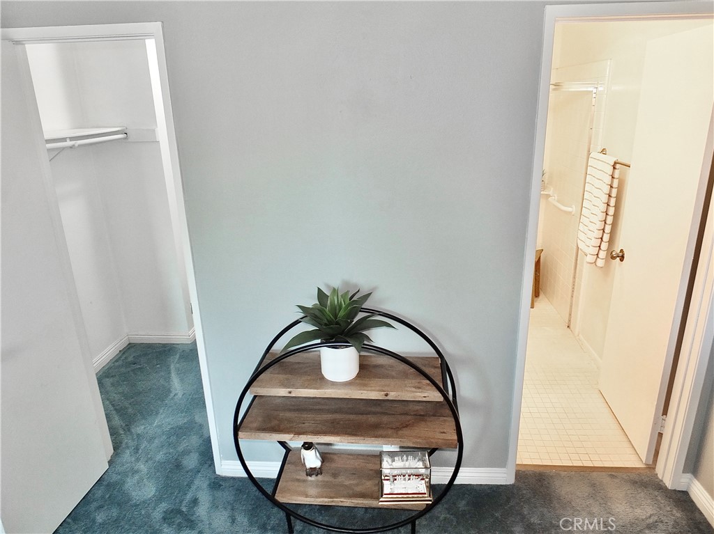 4591 Orange Avenue, Unit 306 Long Beach, CA 90807 - Photo 21 of 34 a view of staircase with kitchen view and mirror