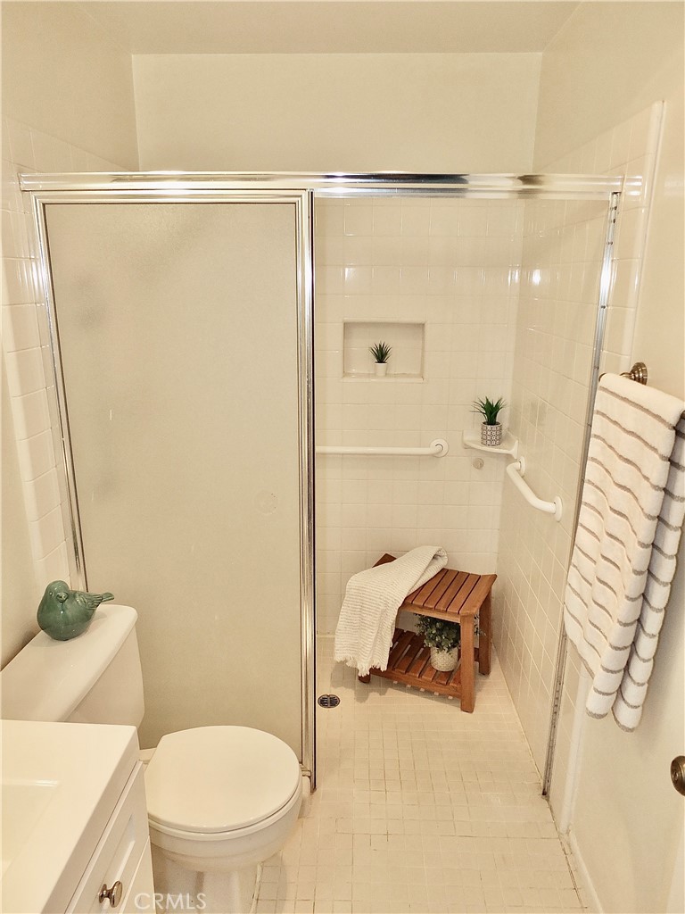4591 Orange Avenue, Unit 306 Long Beach, CA 90807 - Photo 23 of 34 a bathroom with a sink and a mirror