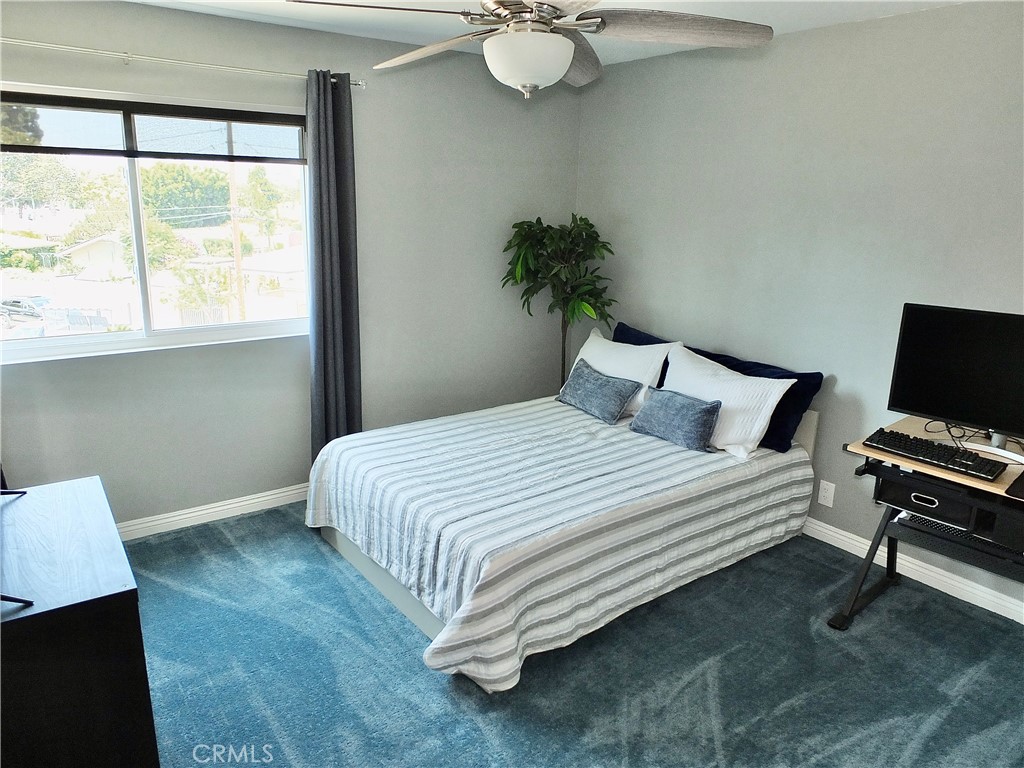 4591 Orange Avenue, Unit 306 Long Beach, CA 90807 - Photo 25 of 34 a bedroom with a bed and a window