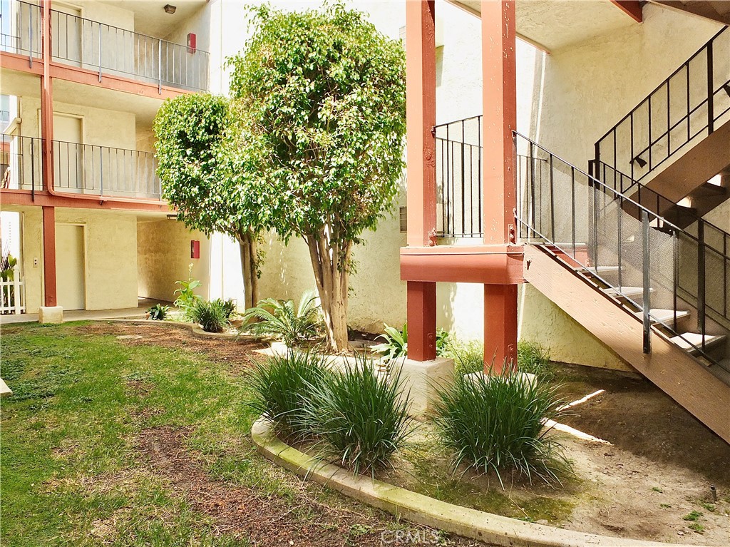 4591 Orange Avenue, Unit 306 Long Beach, CA 90807 - Photo 28 of 34 a house view with a outdoor space