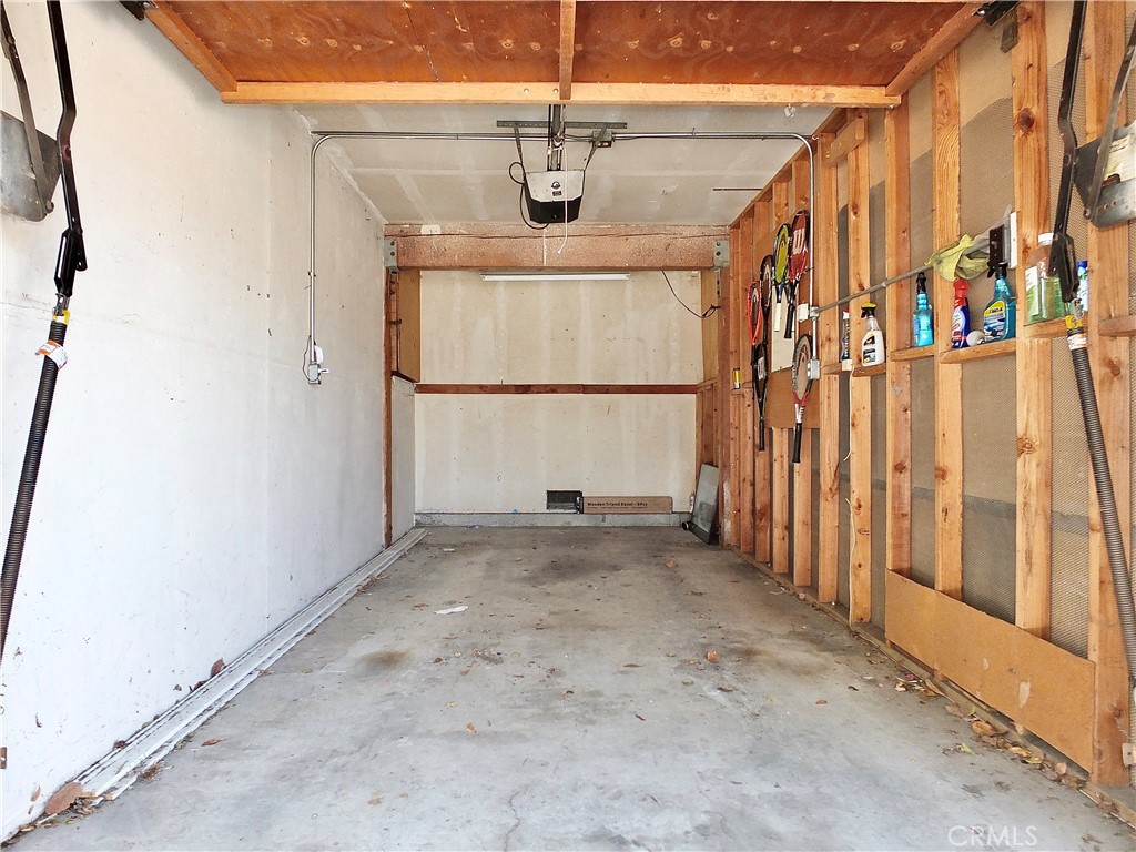 4591 Orange Avenue, Unit 306 Long Beach, CA 90807 - Photo 32 of 34 a view of a garage with wooden floor