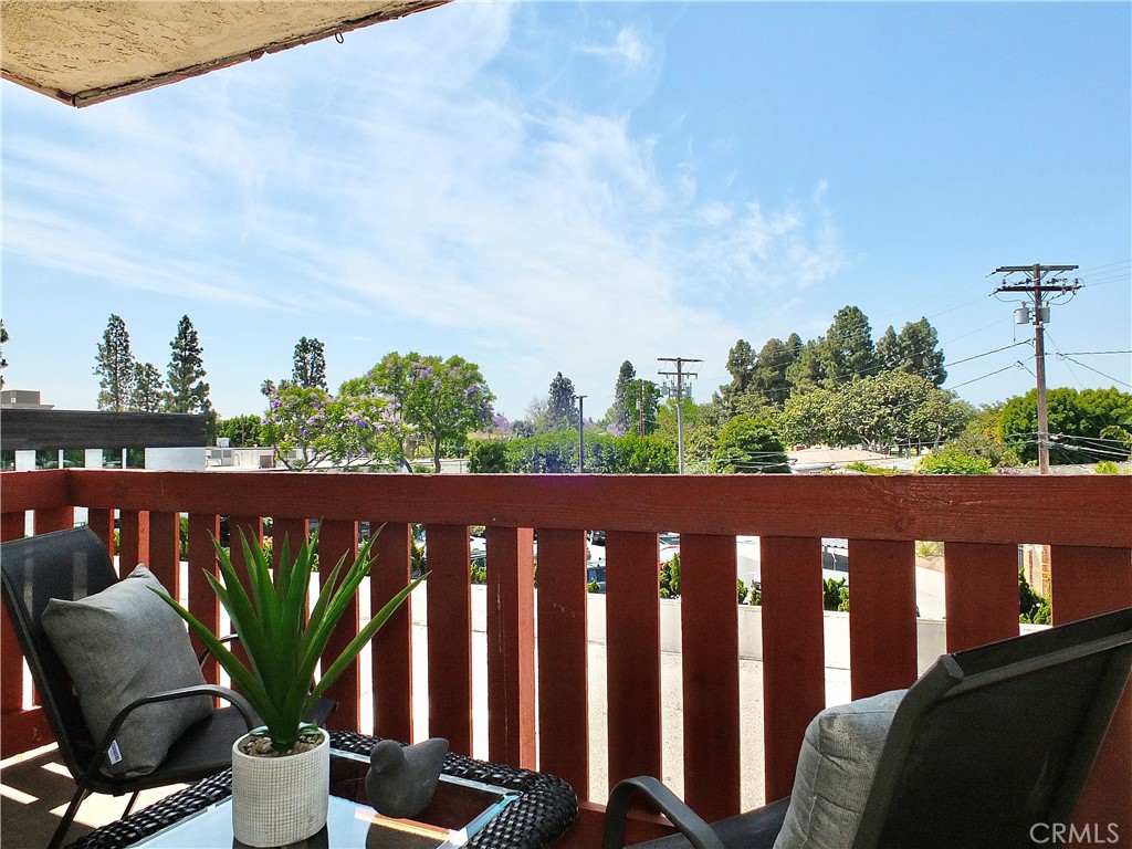 4591 Orange Avenue, Unit 306 Long Beach, CA 90807 - Photo 5 of 34 a view of a chair and table in the balcony