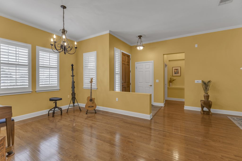144 Cattle Trail Way Georgetown, TX 78633 - Photo 20 of 37 Rich hardwood flooring and warm wall tones define this inviting living space.