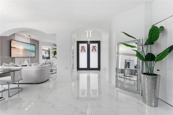 a living room with fireplace furniture and a flat screen tv