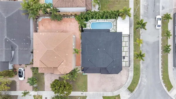 an aerial view of residential houses with outdoor space