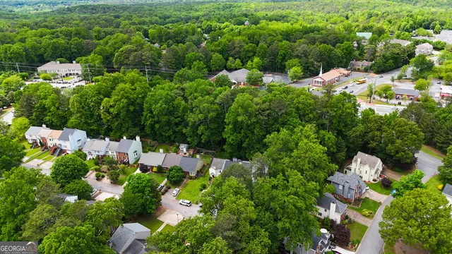 a view of a house with a lot of trees