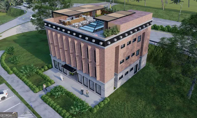 a view of a building with entryway and wooden fence