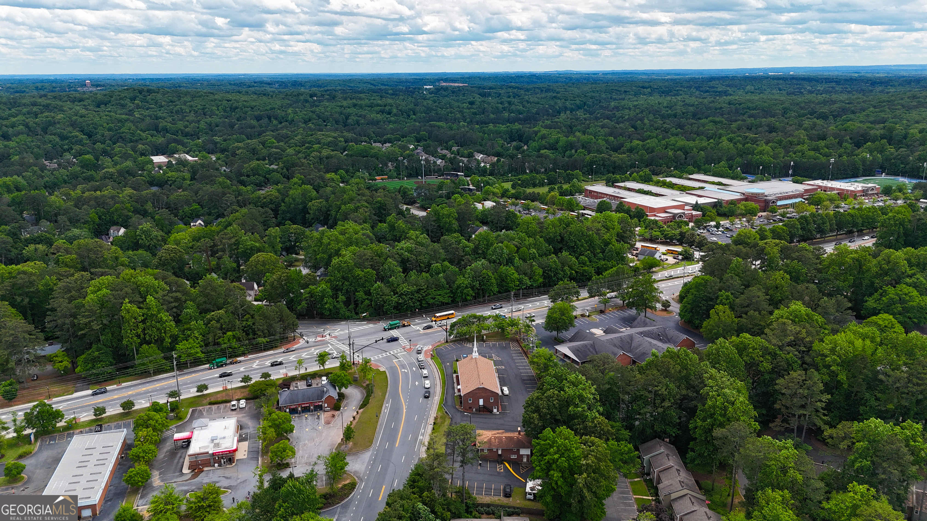 1141 Whitlock Avenue Southwest Marietta, GA 30064 - Photo 2 of 22 an aerial view of residential houses with outdoor space