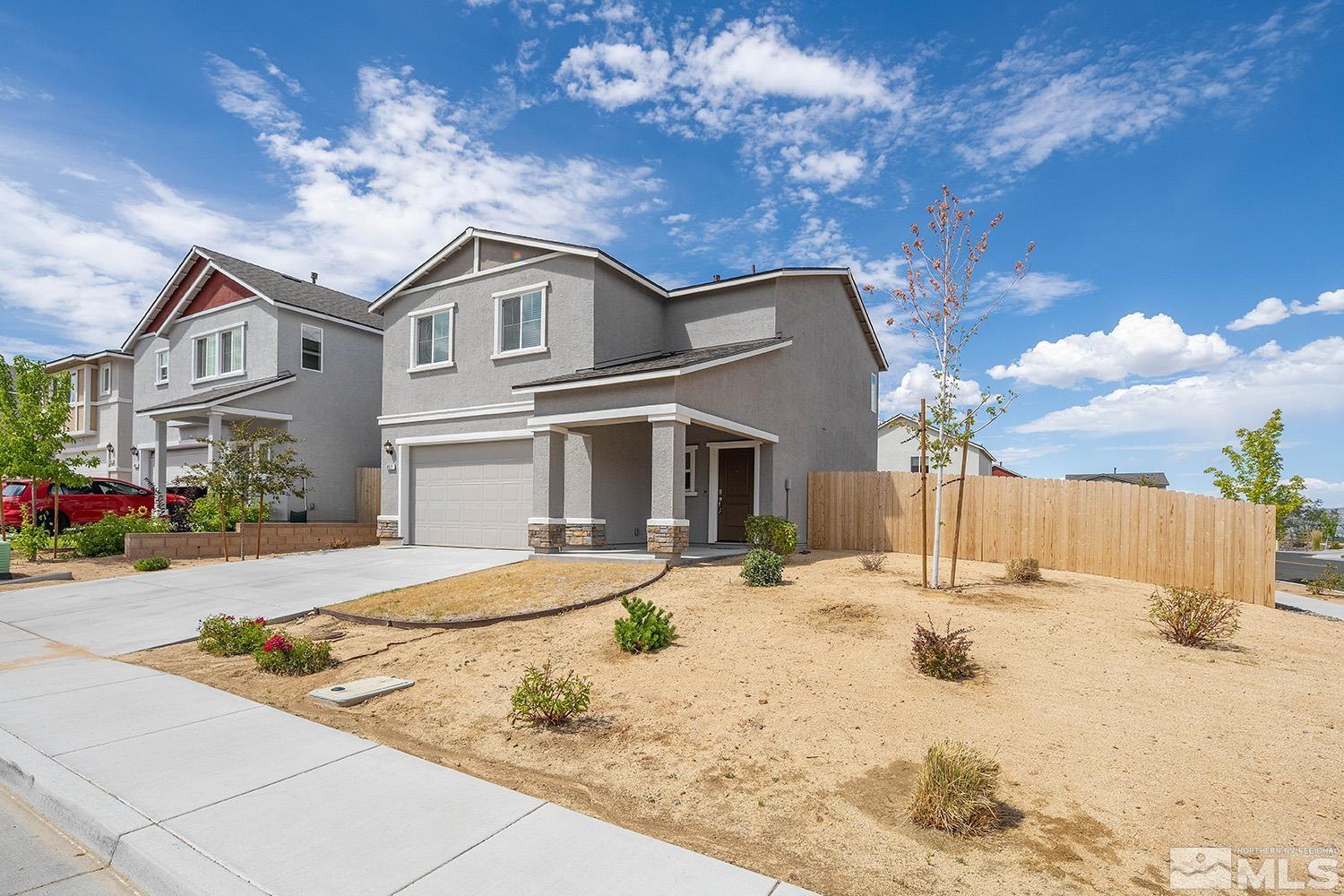 8831 Gazing Star Drive Reno, NV 89506 - Photo 1 of 27 a front view of a house with a yard