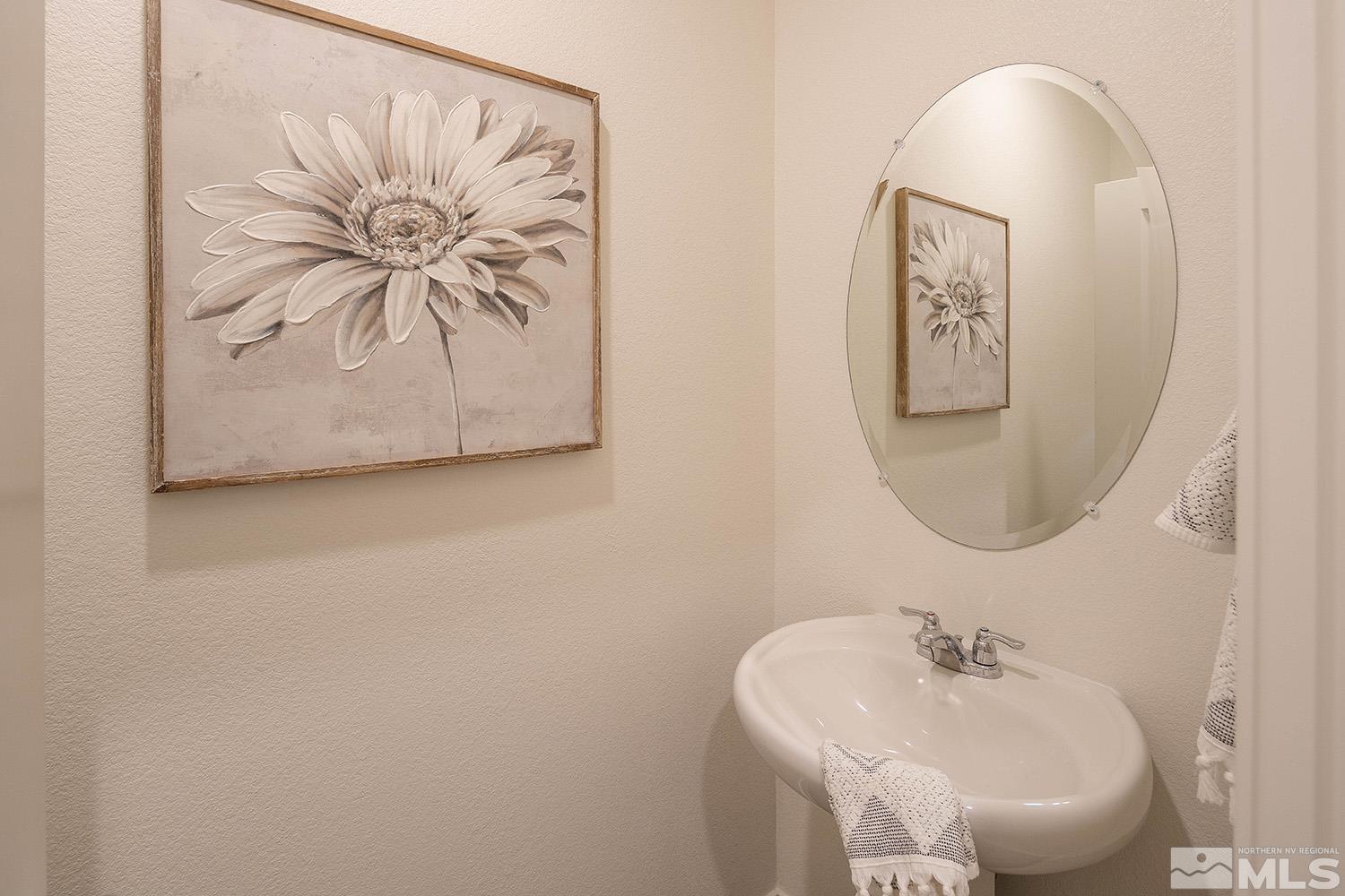 8831 Gazing Star Drive Reno, NV 89506 - Photo 13 of 27 a bathroom with a sink and mirror