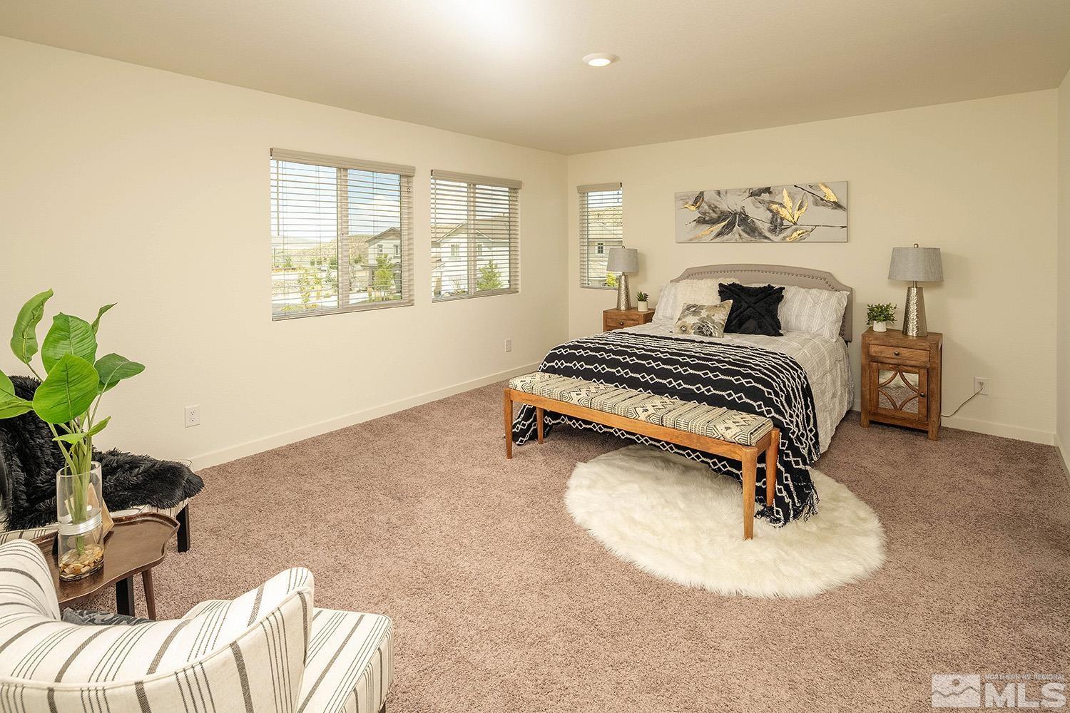 8831 Gazing Star Drive Reno, NV 89506 - Photo 14 of 27 a bedroom with a bed and a couch