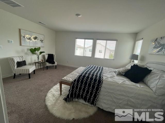 8831 Gazing Star Drive Reno, NV 89506 - Photo 15 of 27 a bedroom with a bed and wooden floor