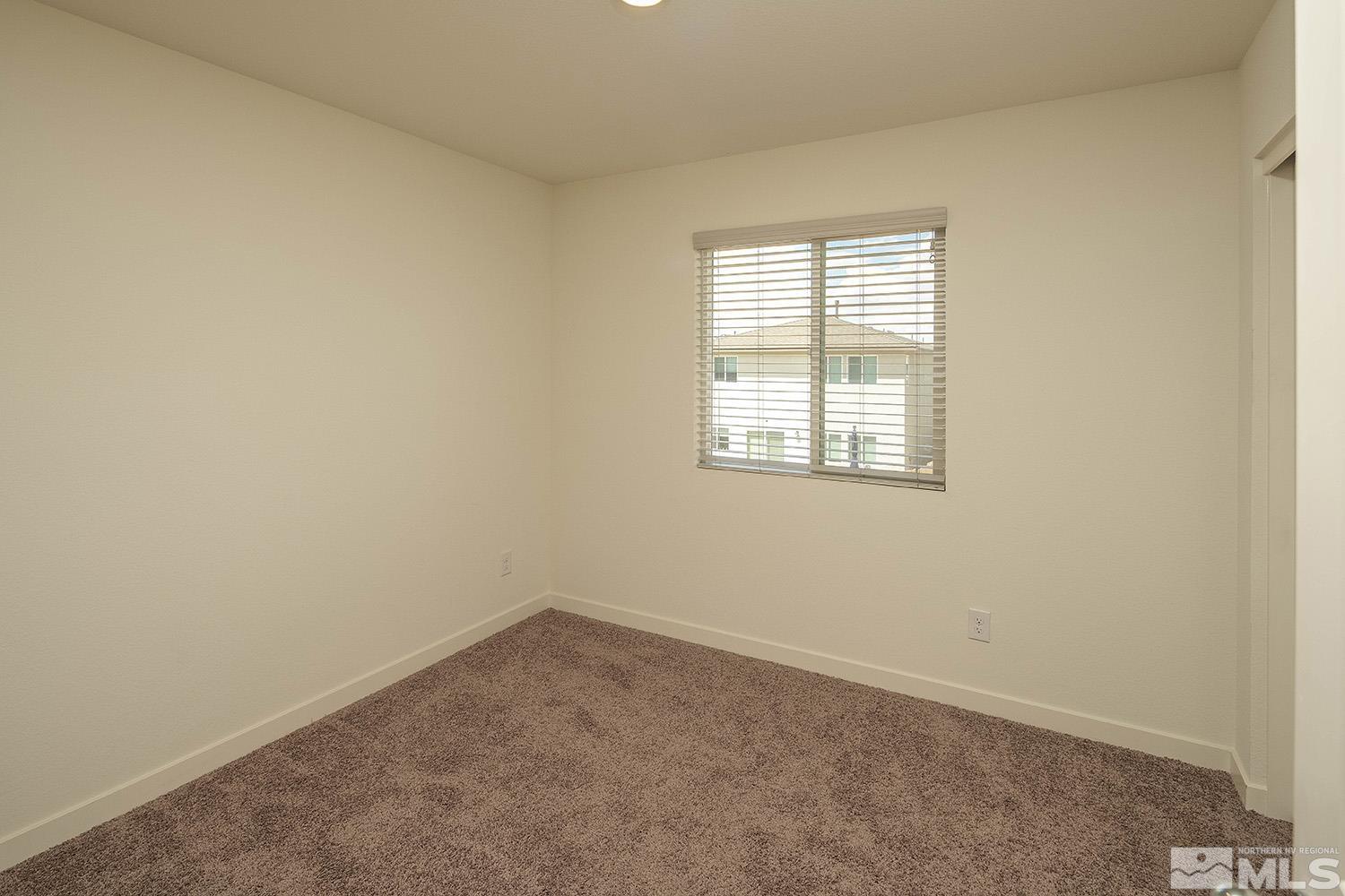 8831 Gazing Star Drive Reno, NV 89506 - Photo 18 of 27 an empty room with a window