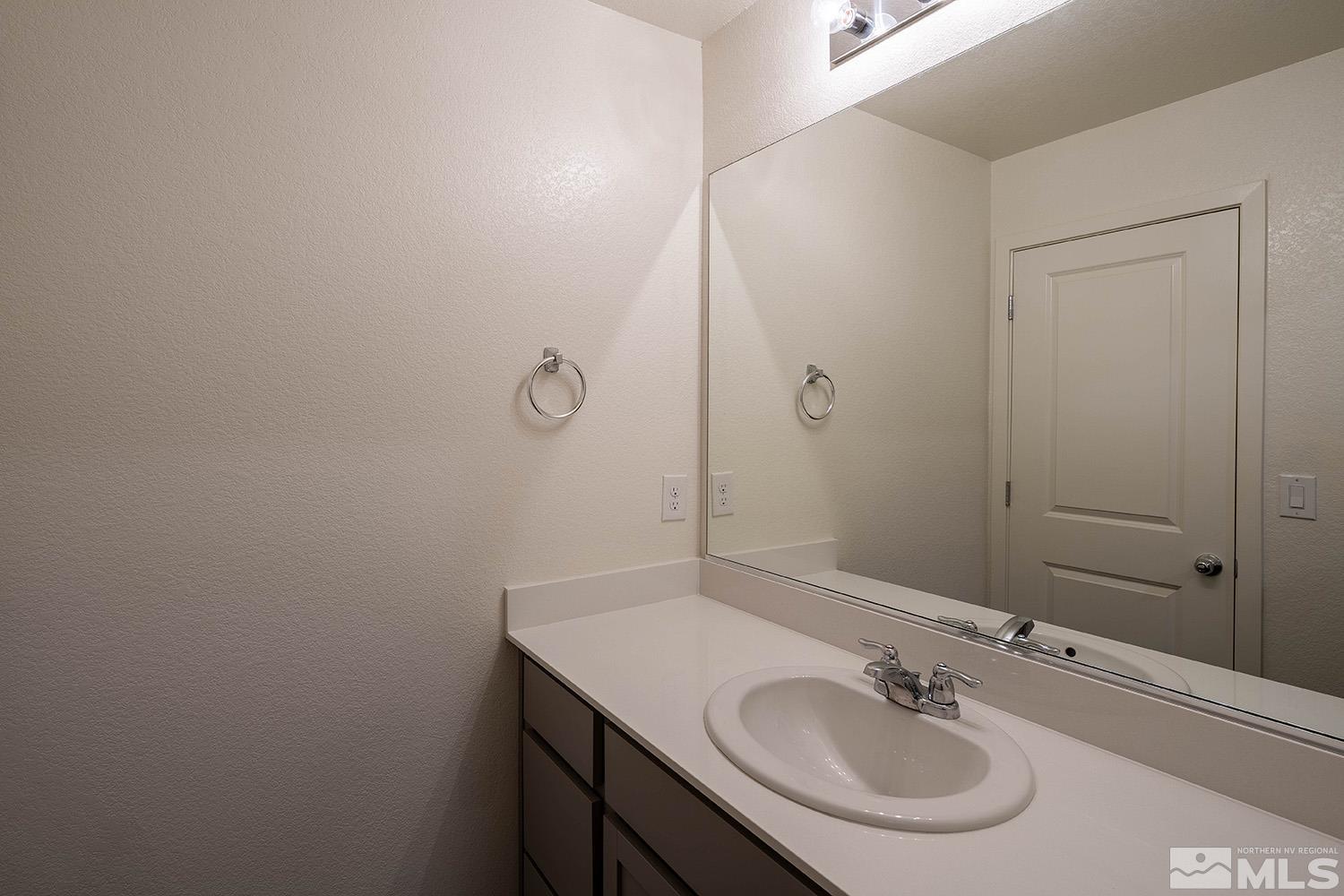 8831 Gazing Star Drive Reno, NV 89506 - Photo 20 of 27 a bathroom with a sink and a mirror