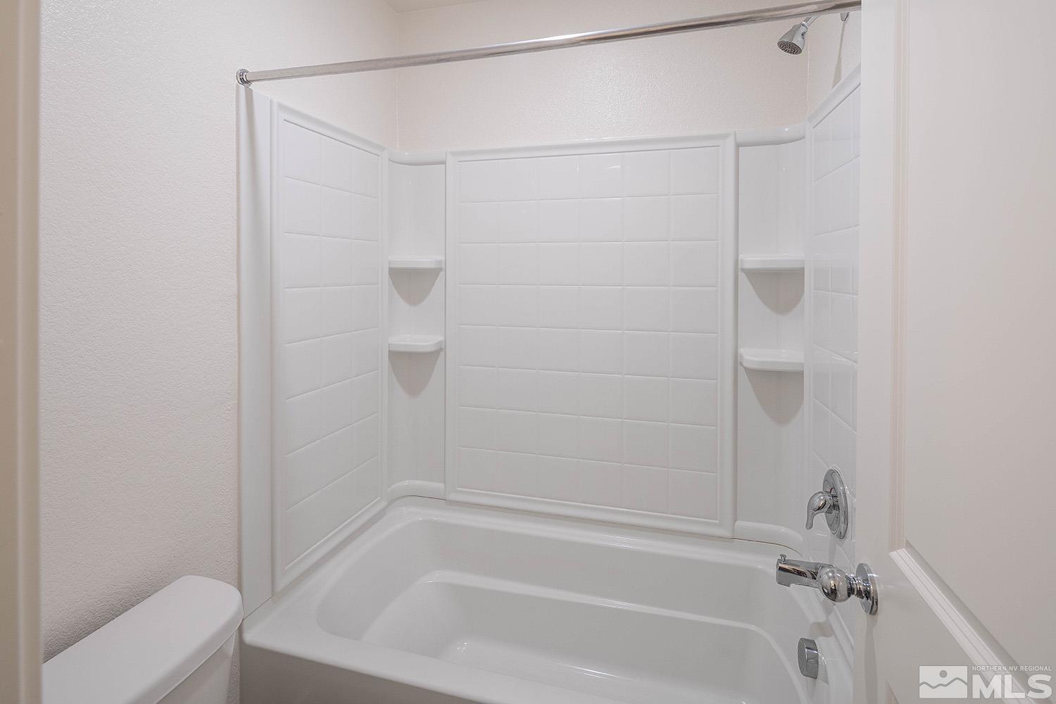 8831 Gazing Star Drive Reno, NV 89506 - Photo 21 of 27 a bathroom with a shower and a bathtub