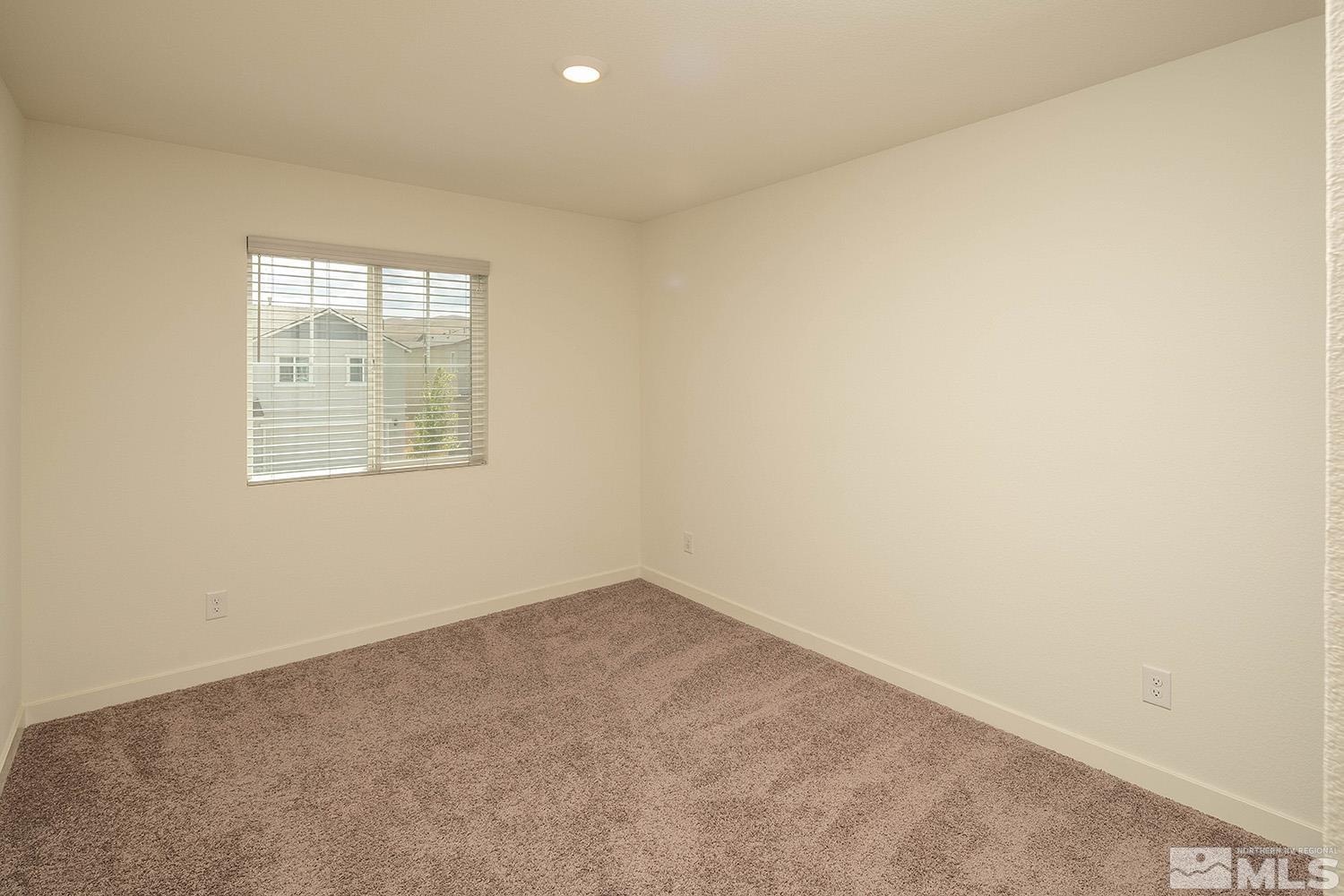 8831 Gazing Star Drive Reno, NV 89506 - Photo 23 of 27 an empty room with a window