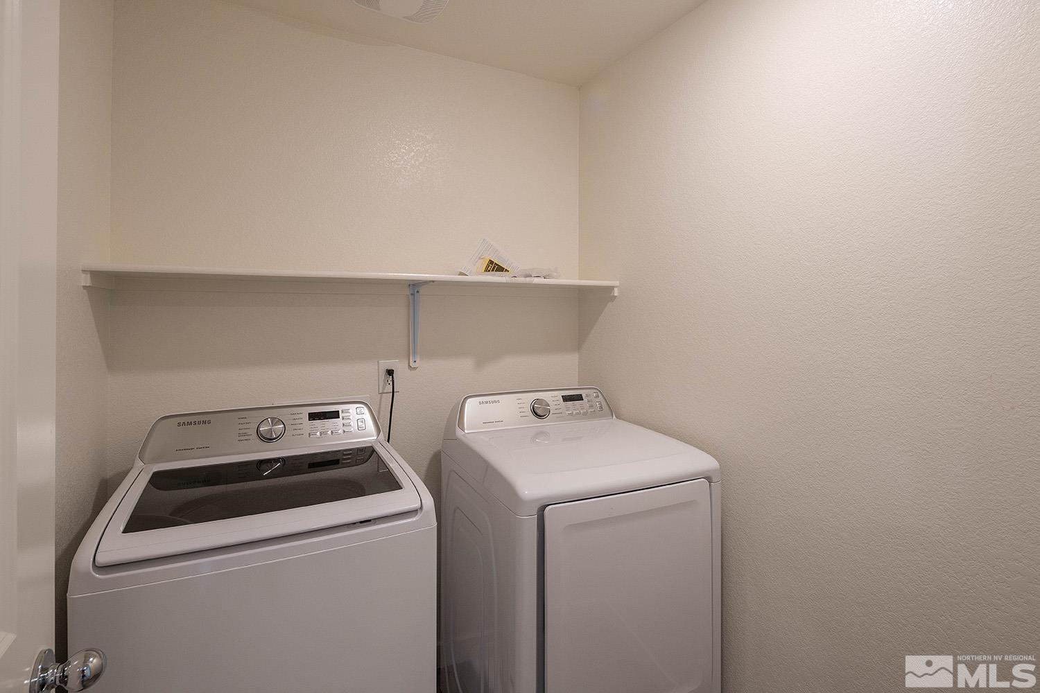 8831 Gazing Star Drive Reno, NV 89506 - Photo 24 of 27 a utility room with dryer and washer