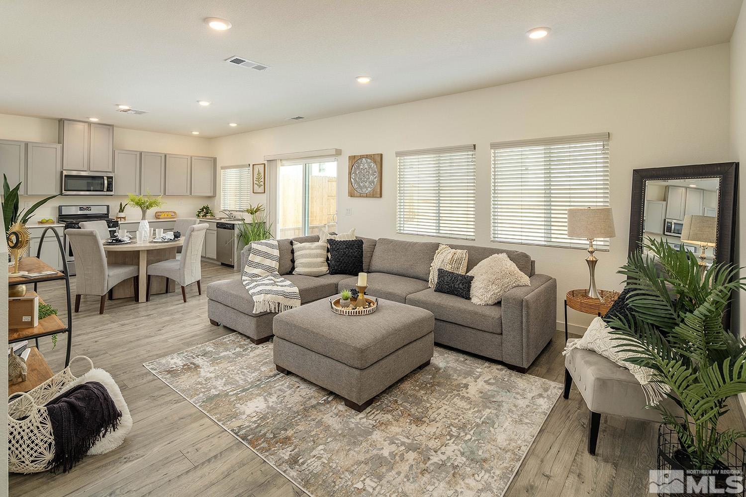 8831 Gazing Star Drive Reno, NV 89506 - Photo 8 of 27 a living room with furniture potted plant and a large window