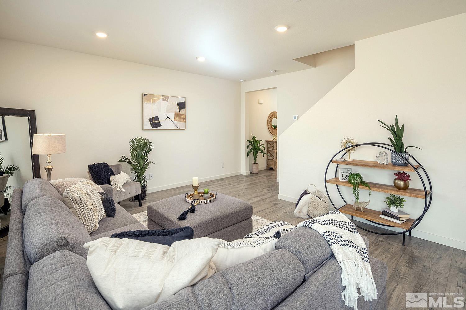 8831 Gazing Star Drive Reno, NV 89506 - Photo 9 of 27 a living room with furniture and white wooden floor