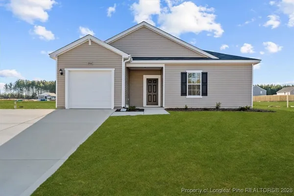 a view of a house with backyard