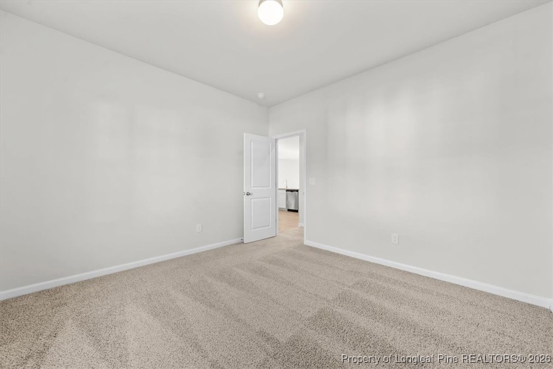 266 Happy Trail Road Aberdeen, NC 28315 - Photo 20 of 34 a view of an empty room and a lamp