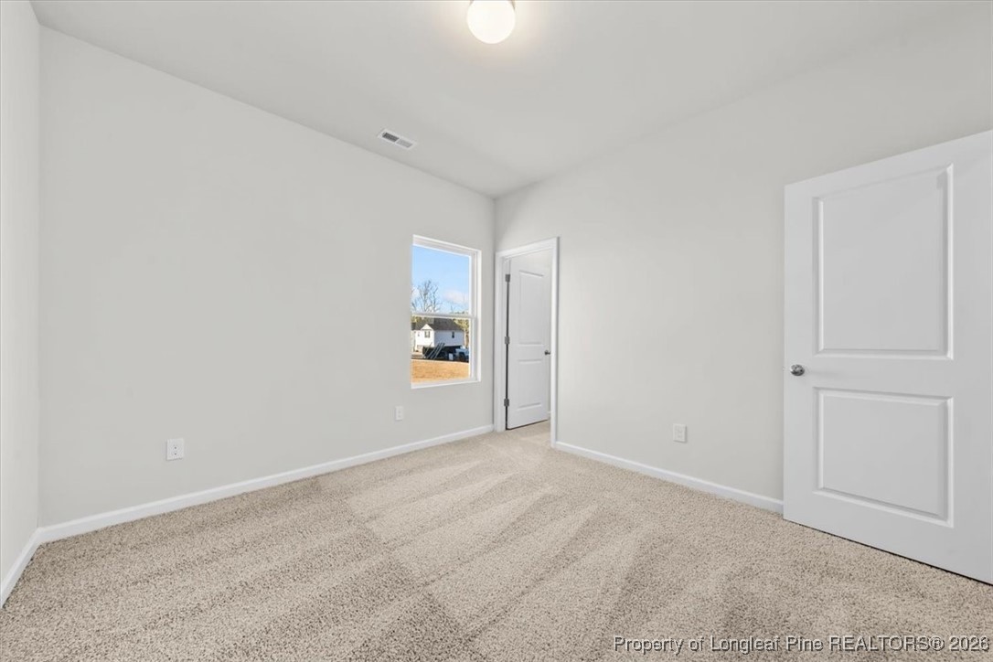 266 Happy Trail Road Aberdeen, NC 28315 - Photo 22 of 34 a view of an empty room