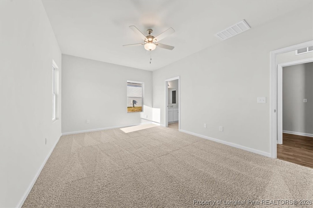 266 Happy Trail Road Aberdeen, NC 28315 - Photo 27 of 34 a view of a livingroom with a ceiling fan