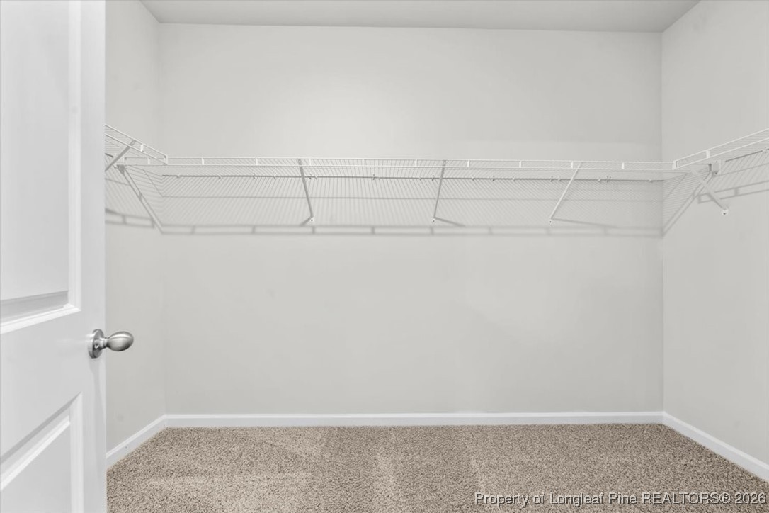 266 Happy Trail Road Aberdeen, NC 28315 - Photo 32 of 34 a view of a room with racks on the wall