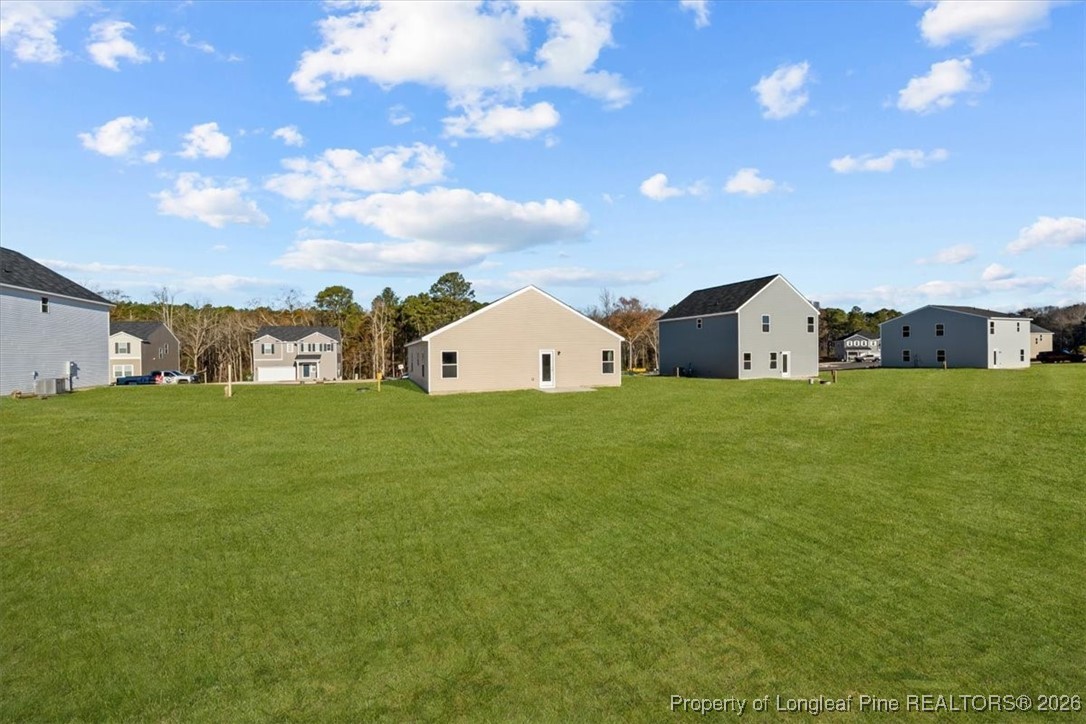266 Happy Trail Road Aberdeen, NC 28315 - Photo 6 of 34 a view of a house with a yard