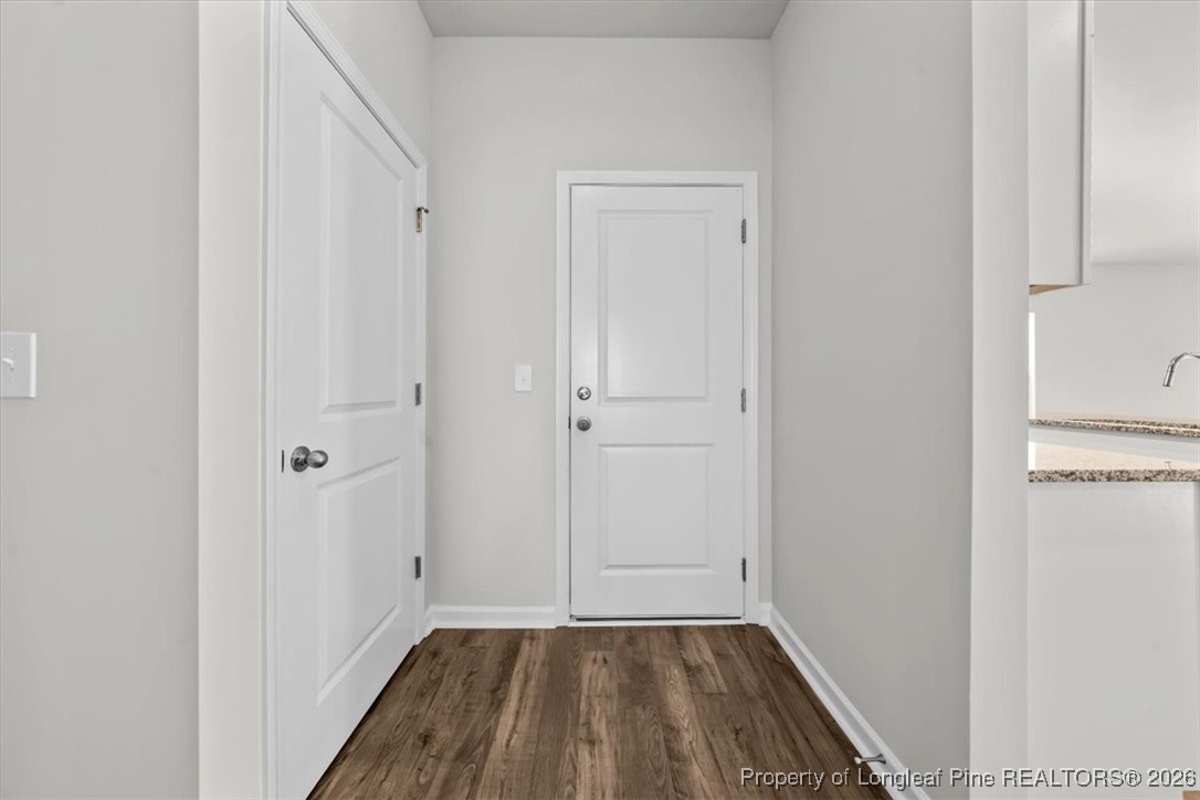 266 Happy Trail Road Aberdeen, NC 28315 - Photo 9 of 34 a view of a small space with wooden floor and closet