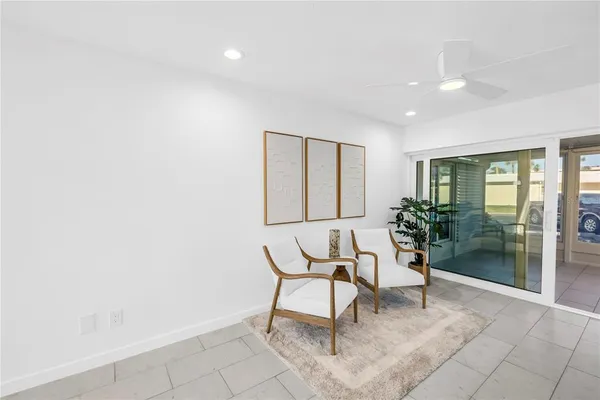 a bedroom with a bed and a night stand