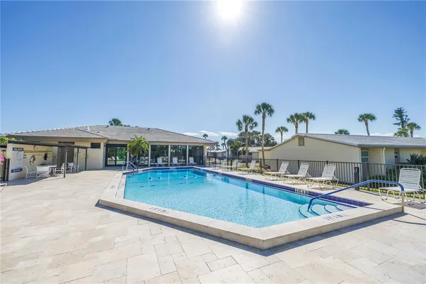 a view of a swimming pool with a patio