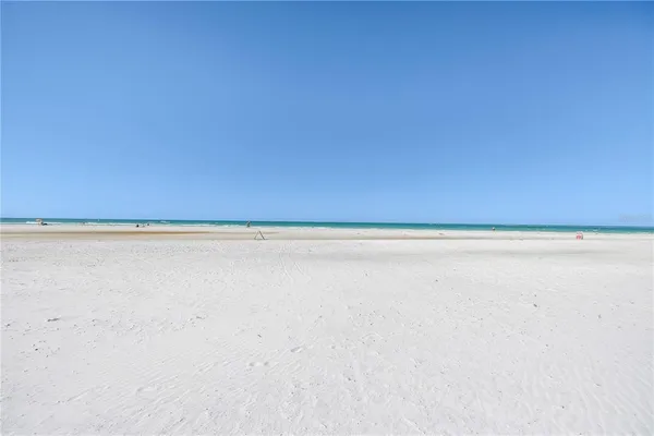 a view of a swimming pool with an outdoor seating