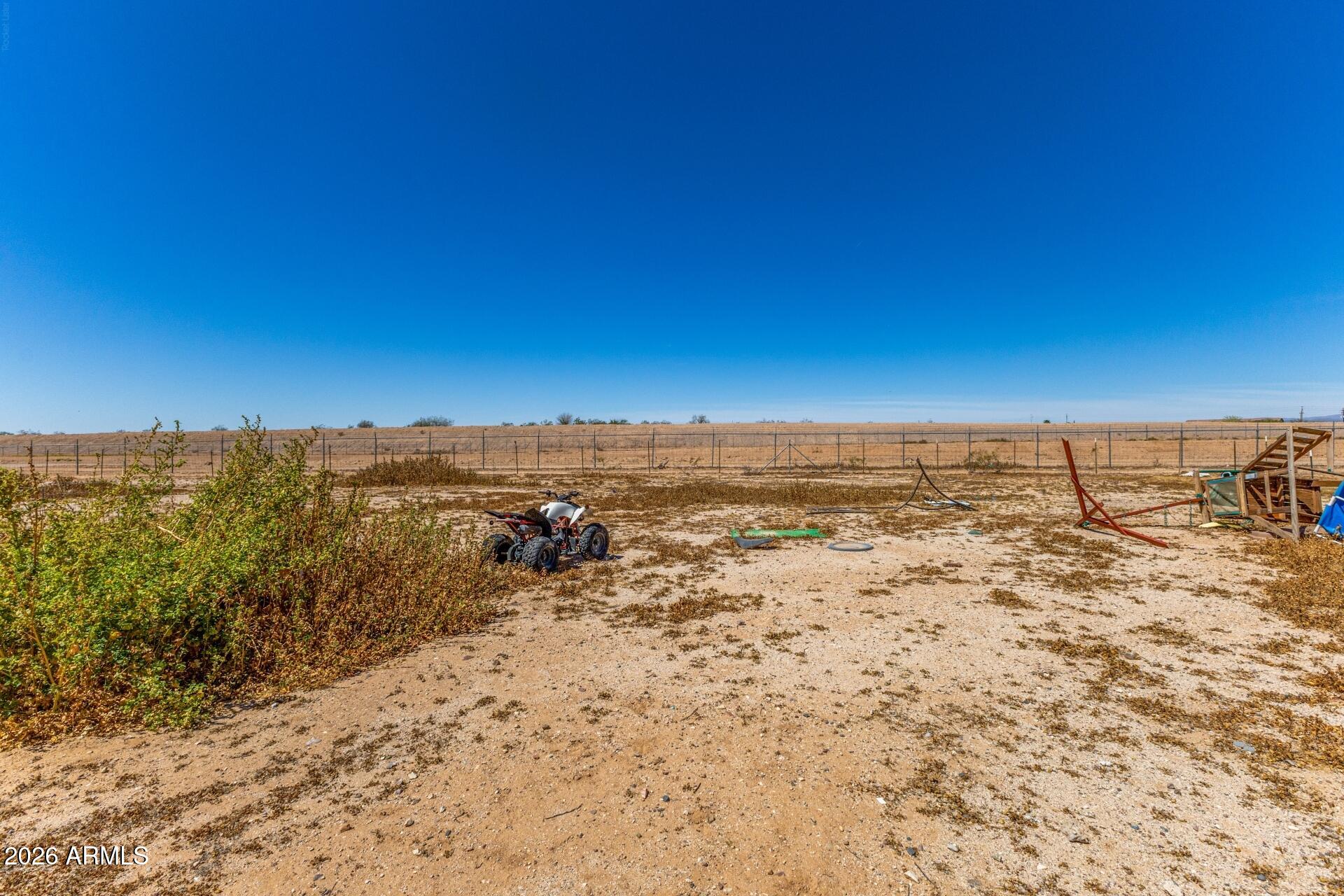 20917 West Black Butte Road Wittmann, AZ 85361 - Photo 16 of 22 a view of a large body of water with a building in the background