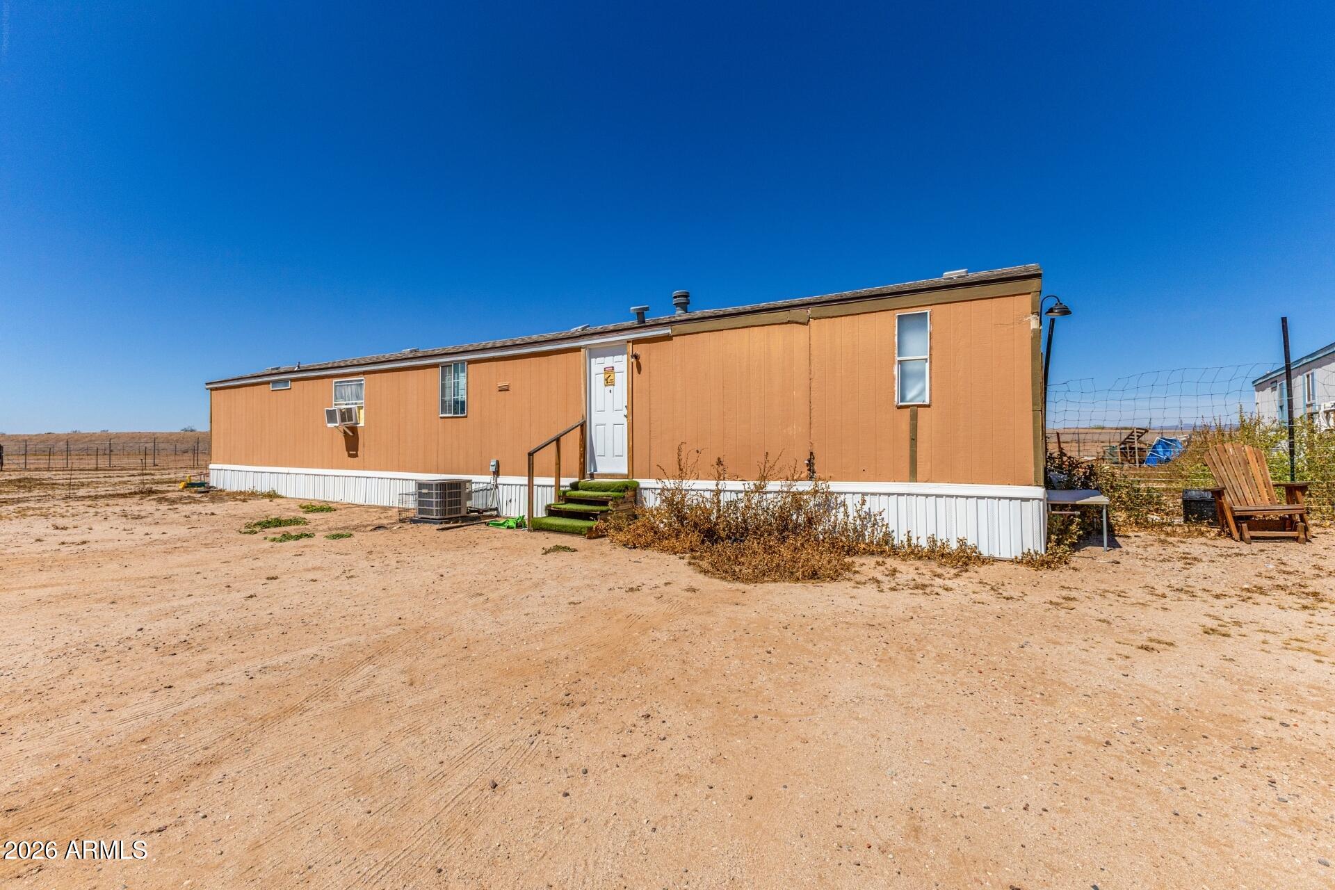 20917 West Black Butte Road Wittmann, AZ 85361 - Photo 17 of 22 a view of a house with a snow in the background