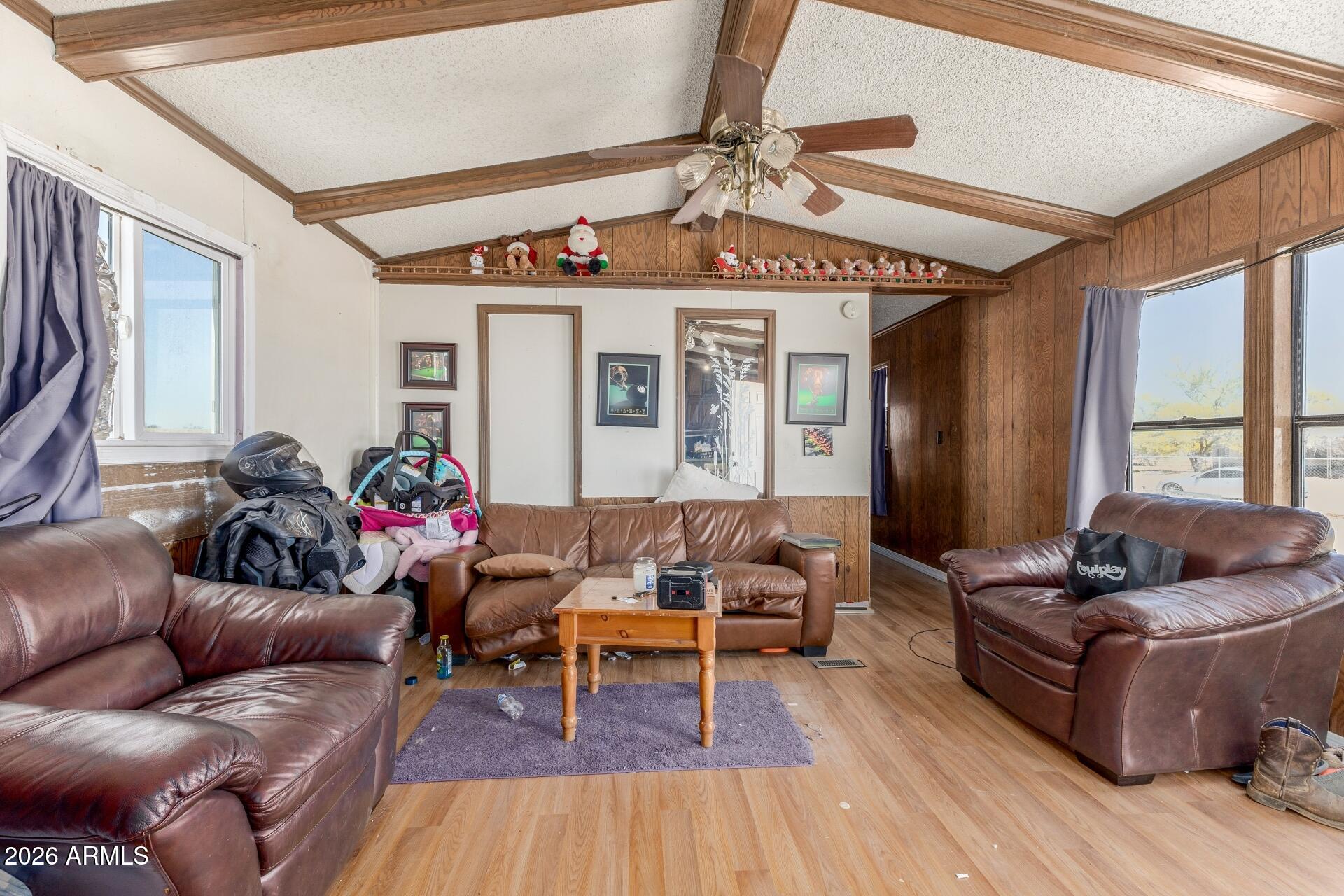 20917 West Black Butte Road Wittmann, AZ 85361 - Photo 5 of 22 a living room with furniture and wooden floor