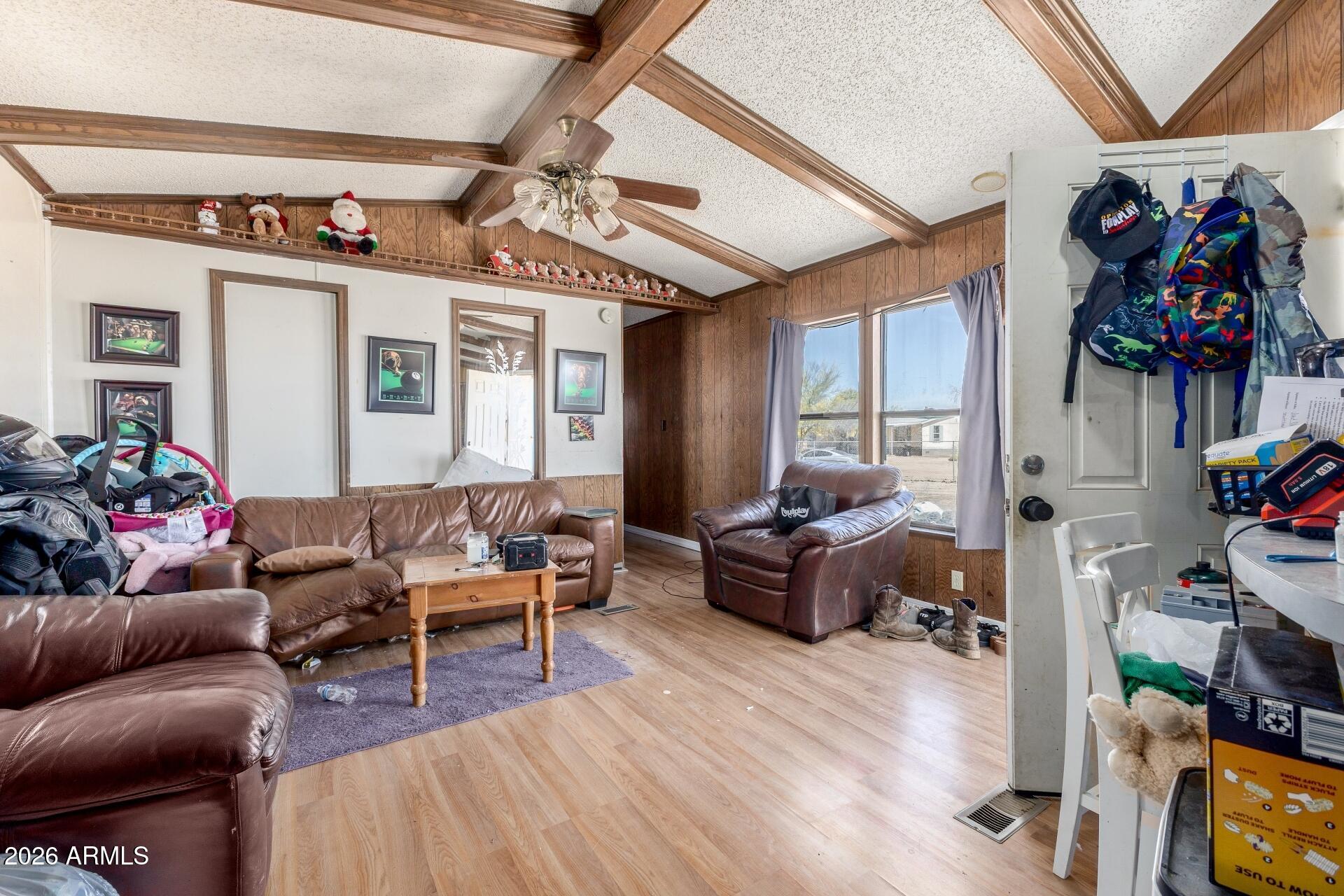 20917 West Black Butte Road Wittmann, AZ 85361 - Photo 6 of 22 a living room with furniture and a flat screen tv