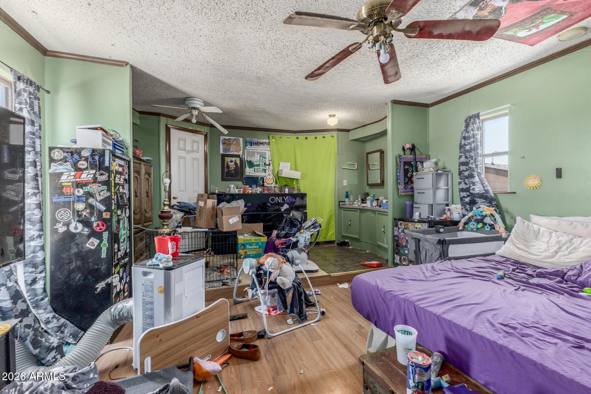 20917 West Black Butte Road Wittmann, AZ 85361 - Photo 10 of 22 a bed room with a bed mirror and a desk