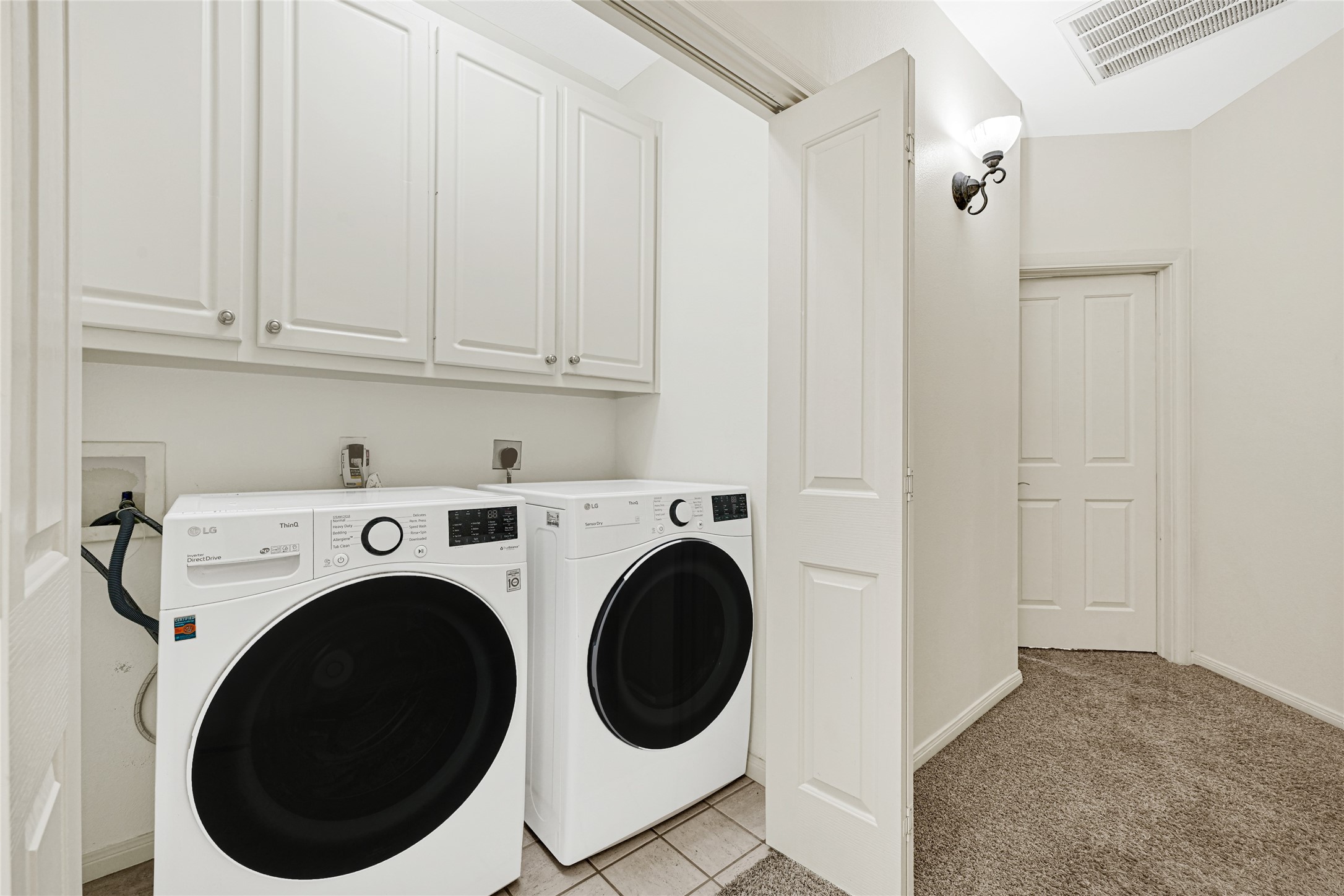 2414 Calumet Street, Unit B Houston, TX 77004 - Photo 24 of 27 a view of a hallway with washer and dryer