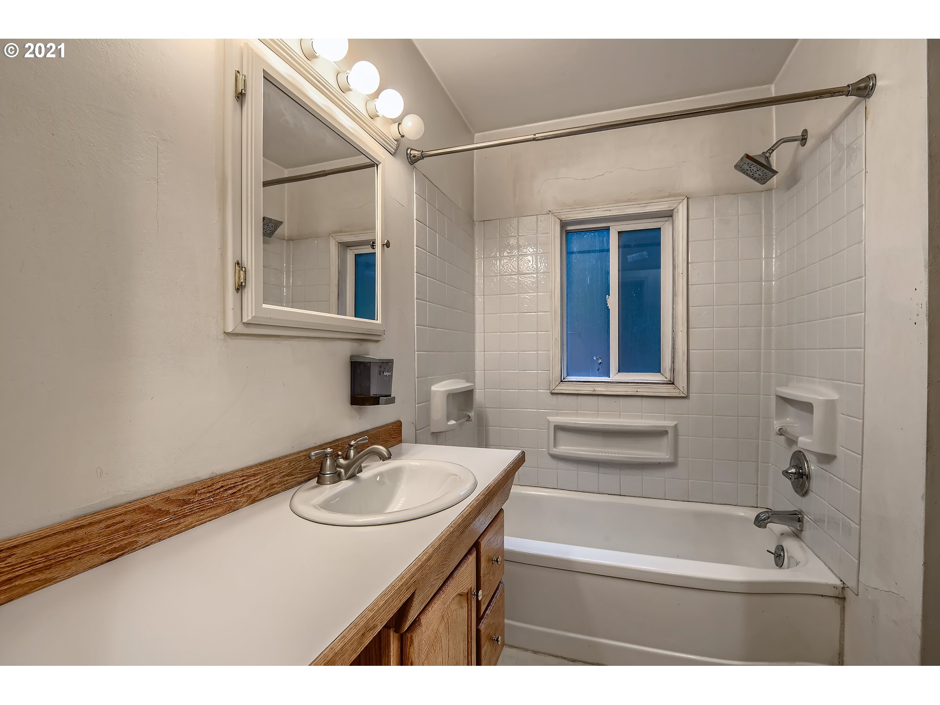 12044 Southeast Foster Road Portland, OR 97266 - Photo 17 of 28 a bathroom with a sink and a mirror