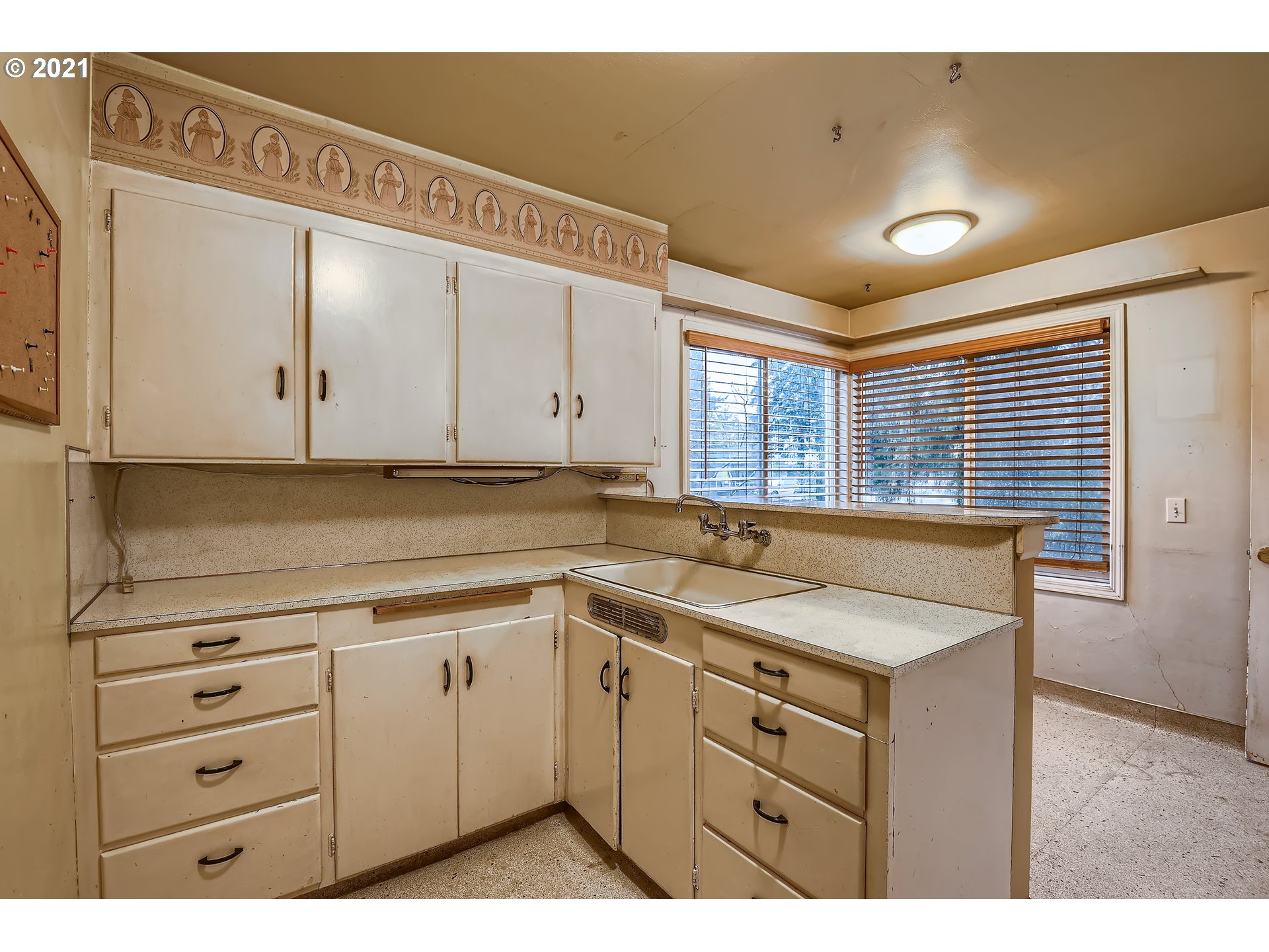 12044 Southeast Foster Road Portland, OR 97266 - Photo 8 of 28 a kitchen with a sink and cabinets