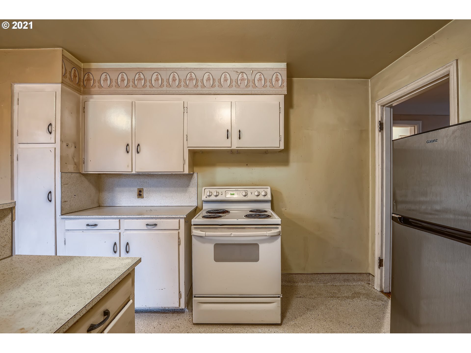 12044 Southeast Foster Road Portland, OR 97266 - Photo 10 of 28 a kitchen with a stove and a sink