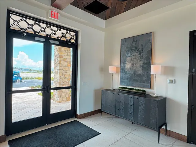 a view of a hallway with front door