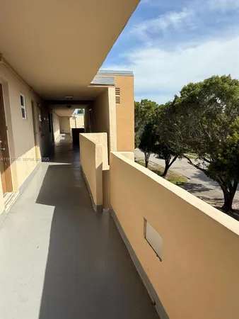 a view of balcony with furniture