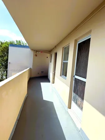 a view of a swimming pool with a backyard