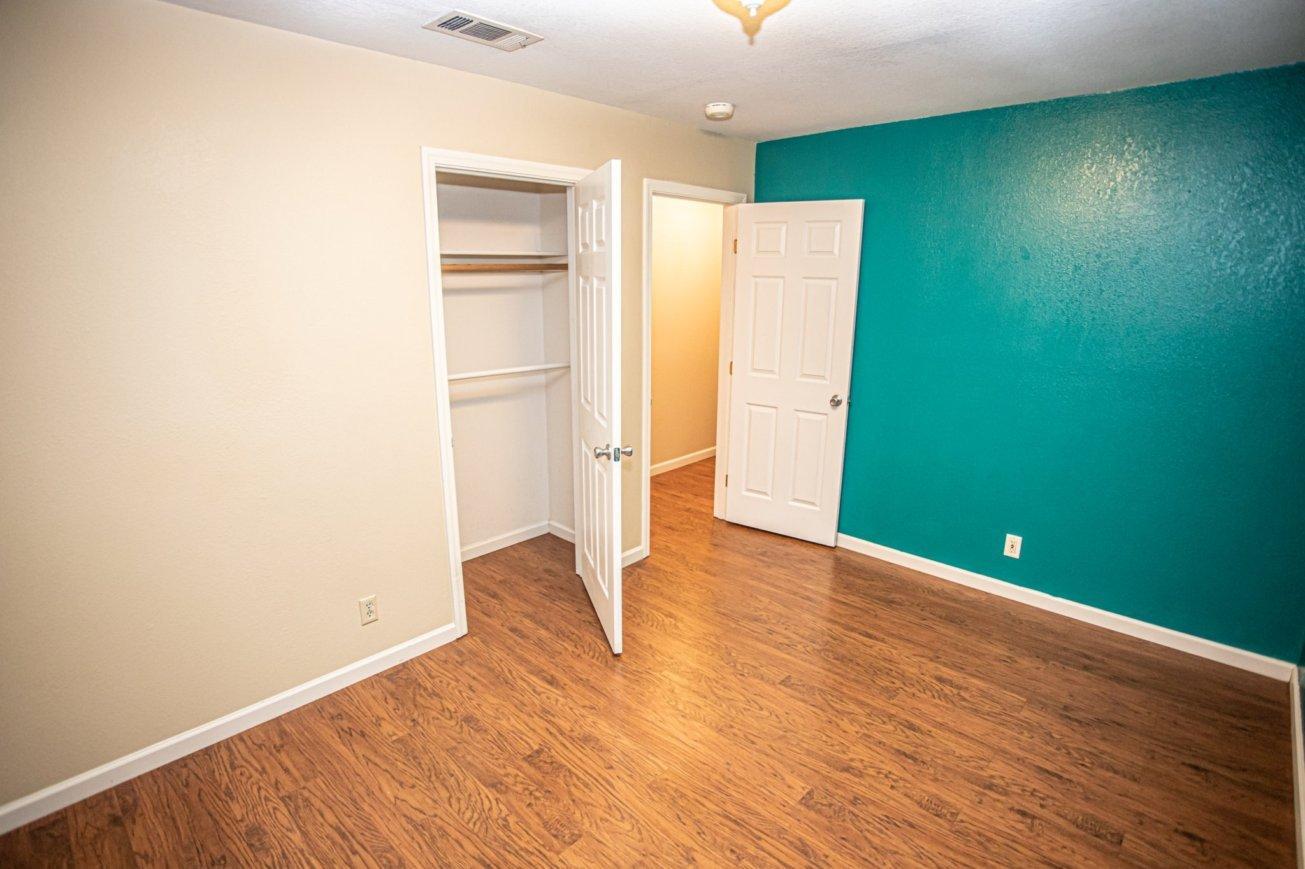 839 Springer Drive Redding, CA 96003 - Photo 7 of 10 a view of empty room with wooden floor