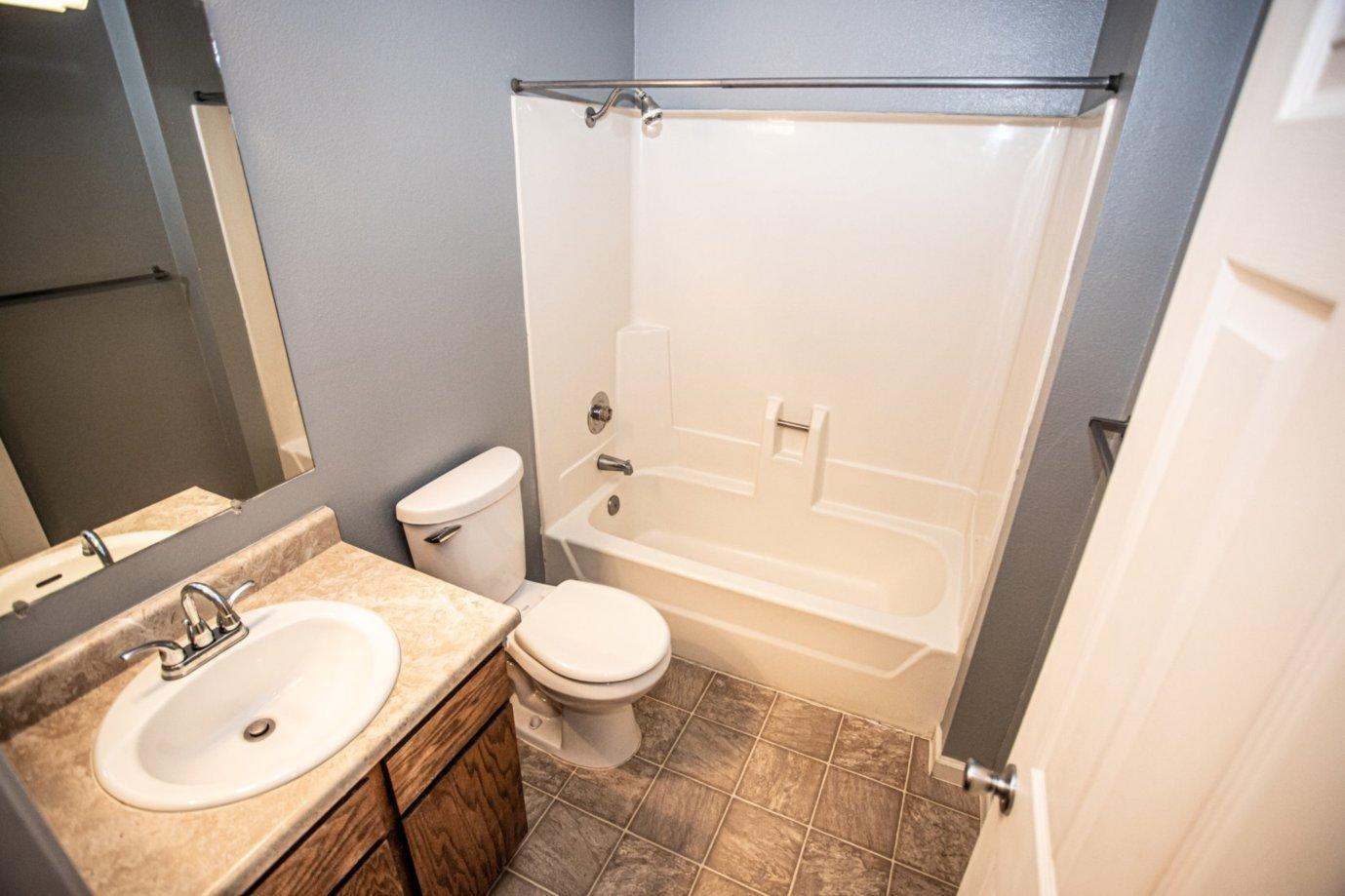 839 Springer Drive Redding, CA 96003 - Photo 8 of 10 a bathroom with a sink toilet and shower