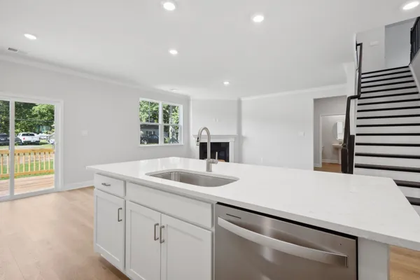 a kitchen with a sink and a refrigerator